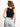 Model is wearing a black high neck crop tank.