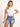 Model is wearing a white nikibiki ribbed short sleeve baby tee.